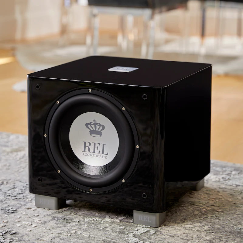 Official REL T/9x shown in a styled room setting.
