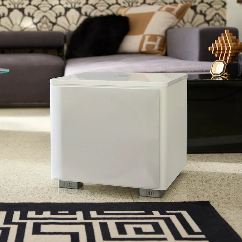 Official REL HT/1205 MKII shown in a styled room setting.
