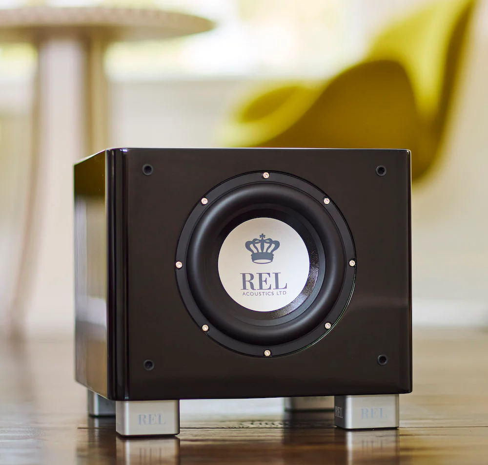 Official REL T/7x shown in a styled room setting.